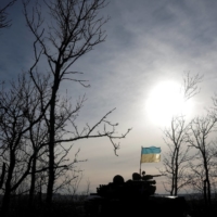 A Ukrainian flag affixed to a tank flutters in the wind in Bakhmut, Ukraine, on Tuesday. | REUTERS