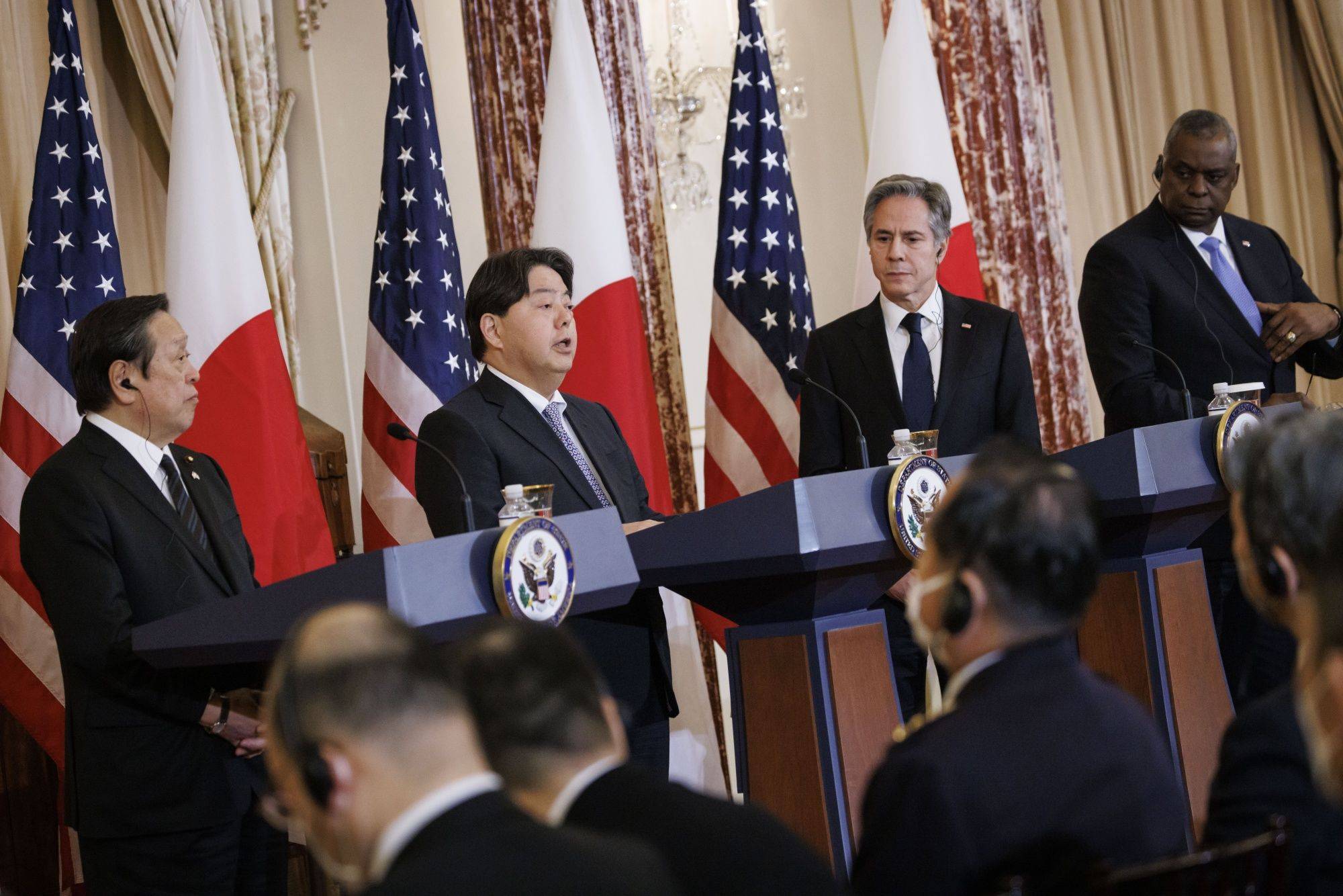 Foreign Minister Yoshimasa Hayashi (second from left) speaks during a news conference with Defense Minster Yasukazu Hamada (left), U.S. Secretary of State Antony Blinken (second from right) and U.S. Defense Secretary Lloyd Austin at the State Department in Washington on Wednesday. | BLOOMBERG