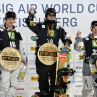 Winner Taiga Hasegawa (center), runner-up Ryoma Kimata (left) and third-place Kira Kimura celebrate on the podium after the men\'s competition of a snowboarding big air World Cup event in Kreischberg, Austria, on Saturday. | KYODO