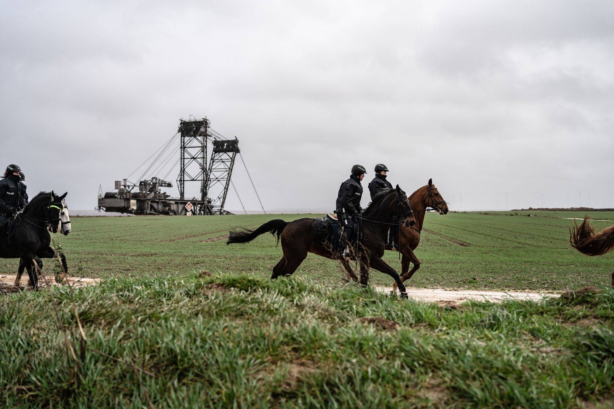 Mounted police prepare to stop environmental activists from entering the Garzweiler lignite mine site close to the condemned village of Luetzerath, in Germany, on Thursday. | BLOOMBERG