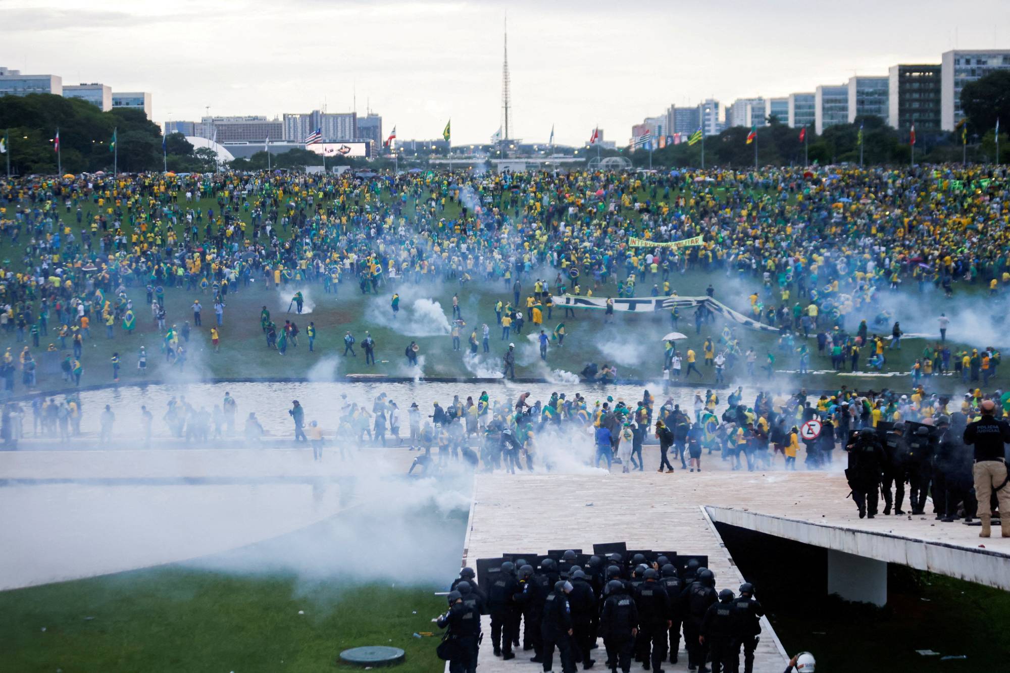 Supporters of former Brazilian President Jair Bolsonaro demonstrate against President Luiz Inacio Lula da Silva as security forces operate outside Brazil’s National Congress in Brasilia on Jan. 8. | REUTERS