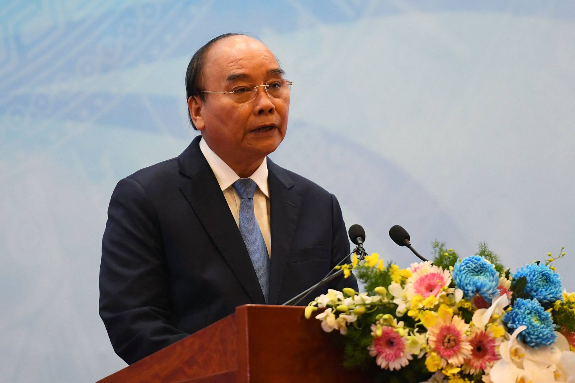 Vietnam's President Nguyen Xuan Phuc speaks at a ceremony commemorating the 45th anniversary of Vietnam's accession to the United Nations in Hanoi's international convention center on Oct. 21. | AFP-JIJI
