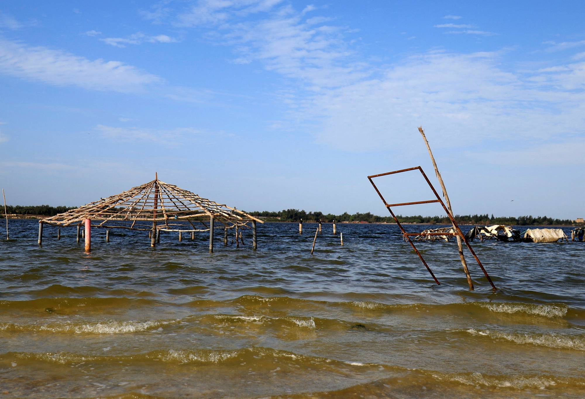 A general view of the submerged tourism businesses at the Pink Lake in Niaga, near Dakar, Senegal. | REUTERS