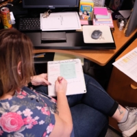 A long COVID-19 patient who is working a reduced schedule, at her office in Illinois in October 2021.  | ALEX WROBLEWSKI / THE NEW YORK TIMES