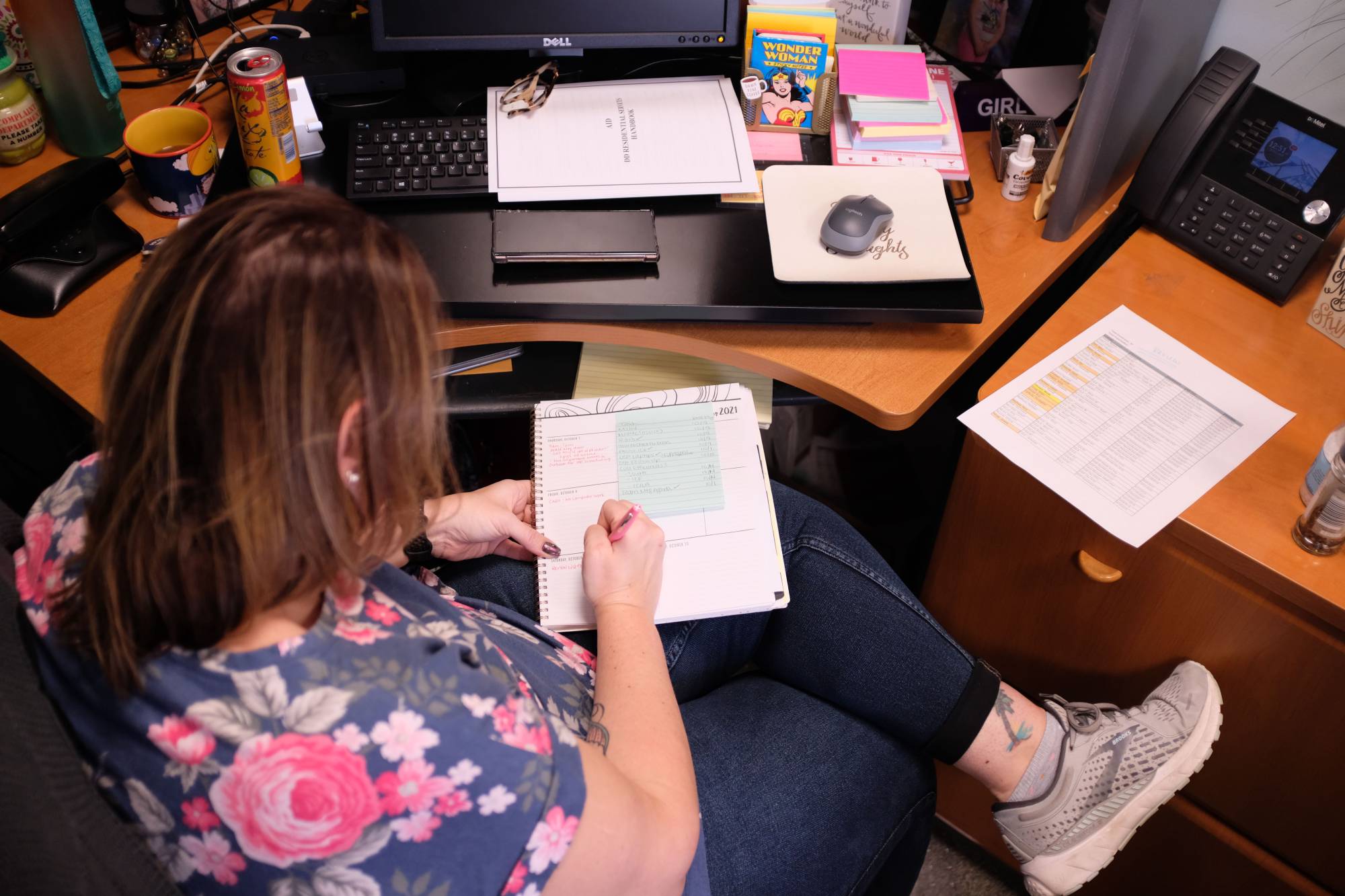 A long COVID-19 patient who is working a reduced schedule, at her office in Illinois in October 2021. | Alex Wroblewski / The New York Times