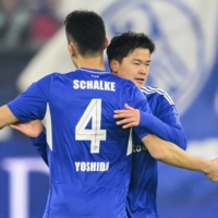Schalke\'s Soichiro Kozuki is congratulated by Maya Yoshida after scoring his first Bundesliga goal in their home match against Leipzig on Tuesday in Gelsenkirchen, Germany. | KYODO