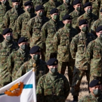 Members of the Ground Self-Defense Force take part in a joint military drill with troops from the U.S., Britain and Australia at Narashino exercise field in Funabashi, Chiba Prefecture, on Jan. 8. | REUTERS