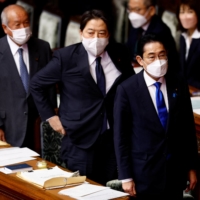 Finance Minister Shunichi Suzuki, Foreign Minister Yoshimasa Hayashi and Prime Minister Fumio Kishida attend the Lower House in Tokyo on Monday. | REUTERS