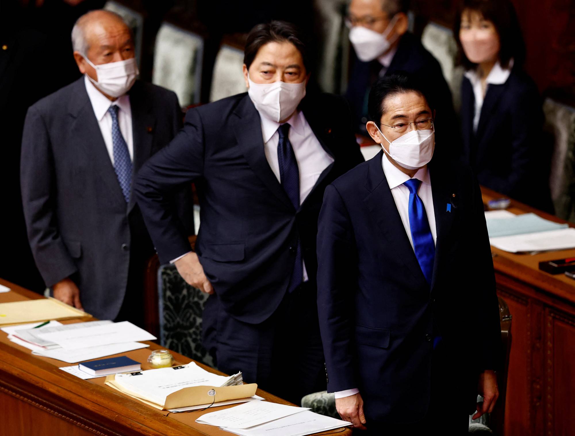 Finance Minister Shunichi Suzuki, Foreign Minister Yoshimasa Hayashi and Prime Minister Fumio Kishida attend the Lower House in Tokyo on Monday. | REUTERS
