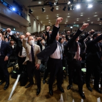 Members of the Japanese Trade Union Confederation attend a rally ahead of  wage negotiations in Tokyo in March 2018. 

  | BLOOMBERG