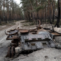 An abandoned Russian tank in the forest of Ruski Tyshky, a village north of Kharkiv, Ukraine, on Jan. 22.  | LYNSEY ADDARIO / THE NEW YORK TIMES