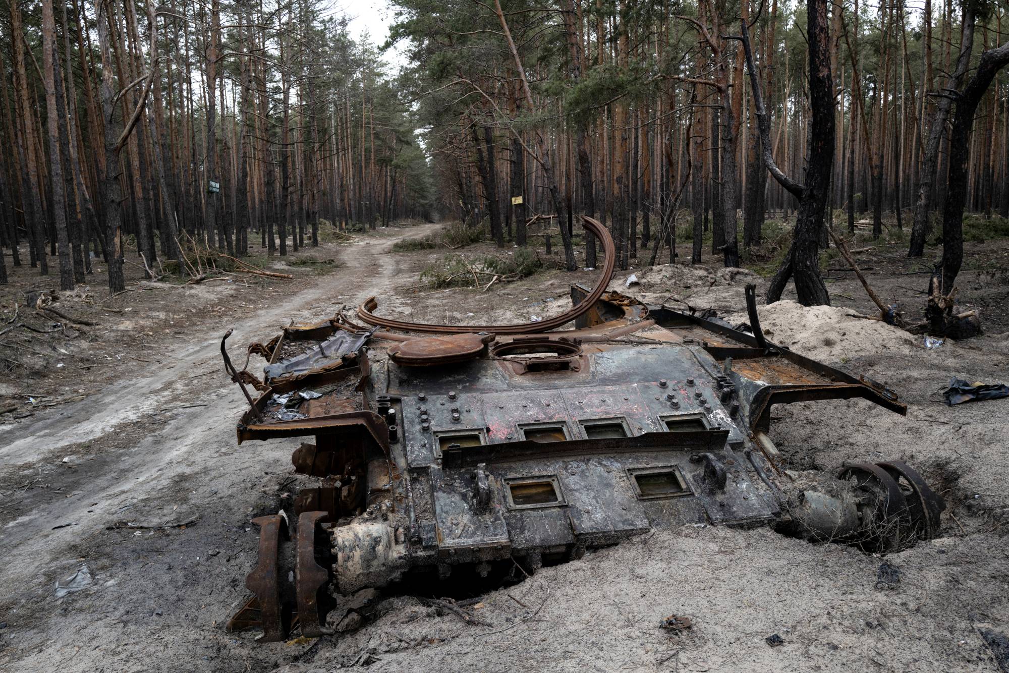 An abandoned Russian tank in the forest of Ruski Tyshky, a village north of Kharkiv, Ukraine, on Jan. 22. | Lynsey Addario / The New York Times