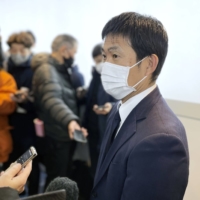 Samurai Blue head coach Hajime Moriyasu speaks to reporters at Haneda International Airport on Saturday. | KYODO