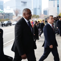 U.S. Secretary of Defense Lloyd Austin and his South Korean counterpart, Lee Jong-sup, leave after a ceremonial welcome at the Defense Ministry in Seoul on Tuesday. | POOL / VIA AFP-JIJI