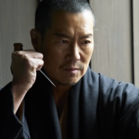 Baian Fujieda (Etsushi Toyokawa) wields his needle with deadly precision in “Baian the Assassin M.D.” | ©︎ BAIAN THE ASSASSIN, M.D. 1 & 2 FILM PARTNERS 42

