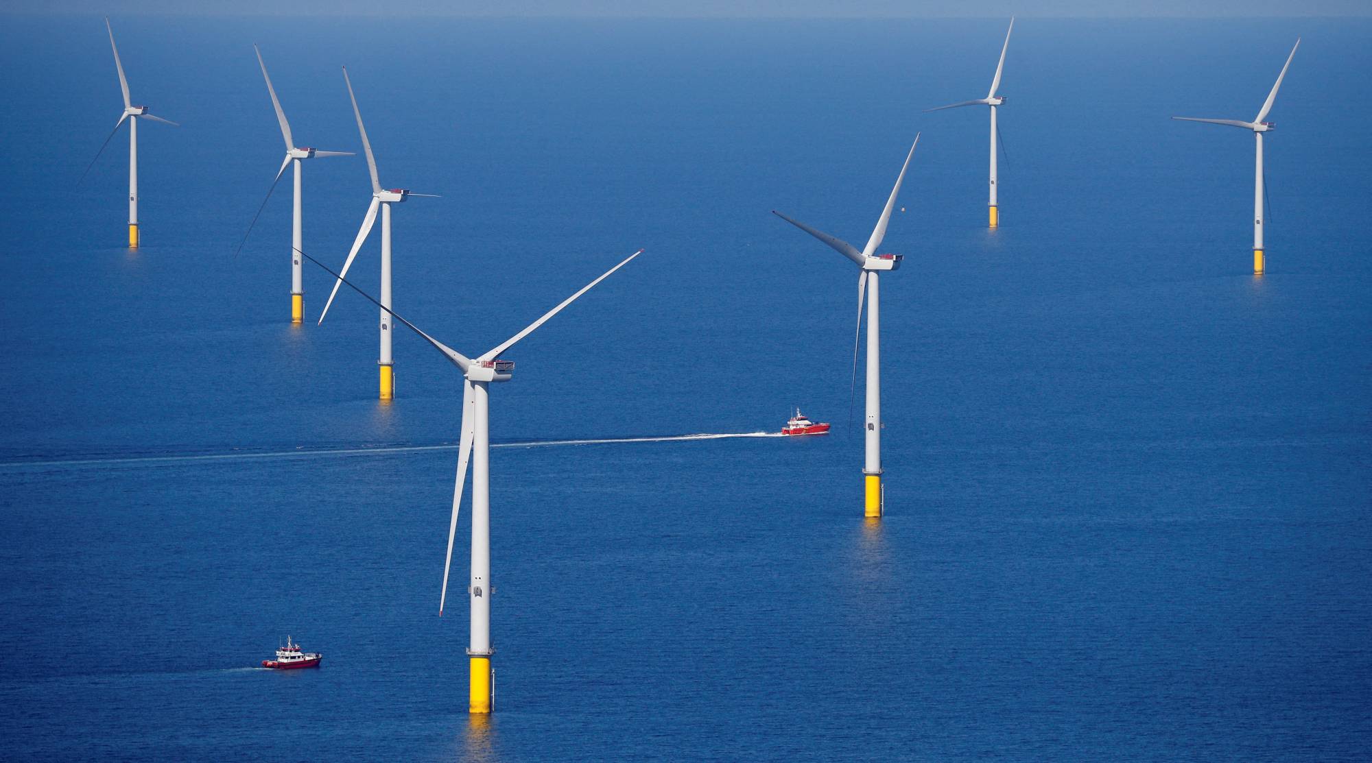Wind turbines off the coast of Blackpool, England. Japan, with its island geography and extensive exclusive economic zone, is thought to have an annual offshore wind capacity of three times the energy used across the nation in all of 2020. | REUTERS