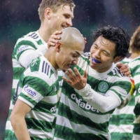 Daizen Maeda is congratulated by teammates after scoring Celtic\'s second goal during the first half of a Scottish Premiership football match against Livingston at Celtic Park in Glasgow, Scotland, on Wednesday. | KYODO