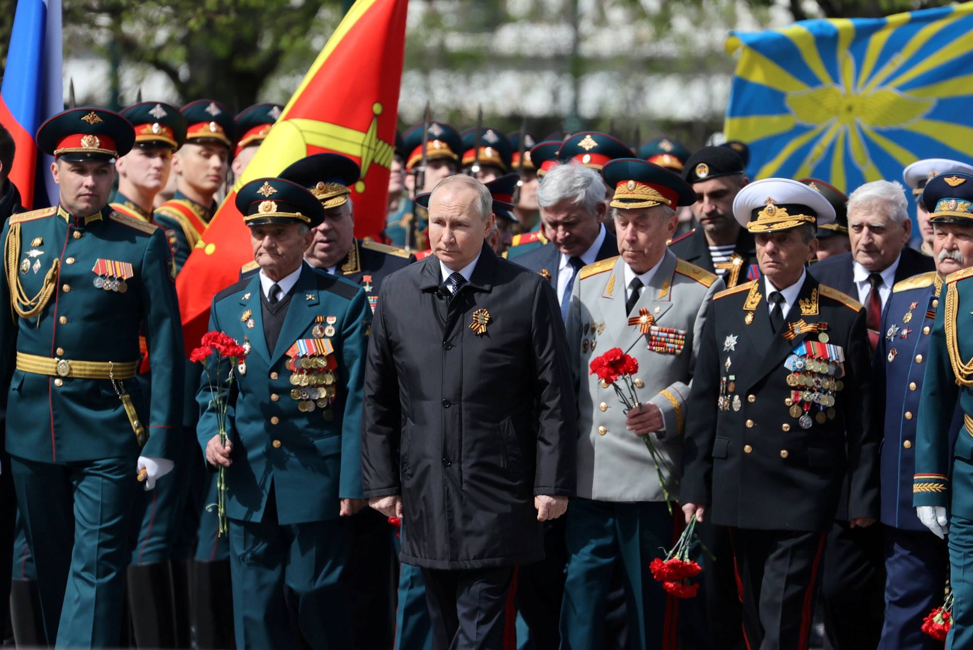 Russian President Vladimir Putin attends a wreath-laying ceremony on Victory Day in Moscow on May 9, the anniversary of the victory over Nazi Germany in World War II. | SPUTNIK / POOL / VIA REUTERS