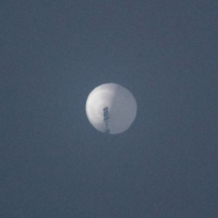 A balloon flies in the sky over Billings, Montana, on Wednesday, in this picture obtained from social media.  | CHASE DOAK / VIA REUTERS  