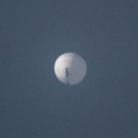 A balloon flies in the sky over Billings, Montana, on Wednesday in this picture obtained from social media.  | CHASE DOAK / VIA REUTERS  