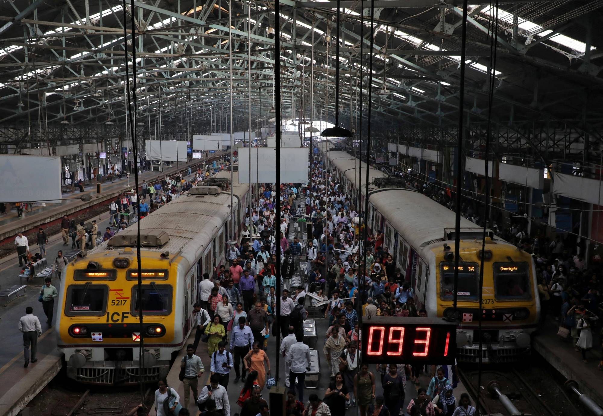 Commuters disembark from suburban trains at Churchgate railway station in Mumbai on Feb. 1. | REUTERS