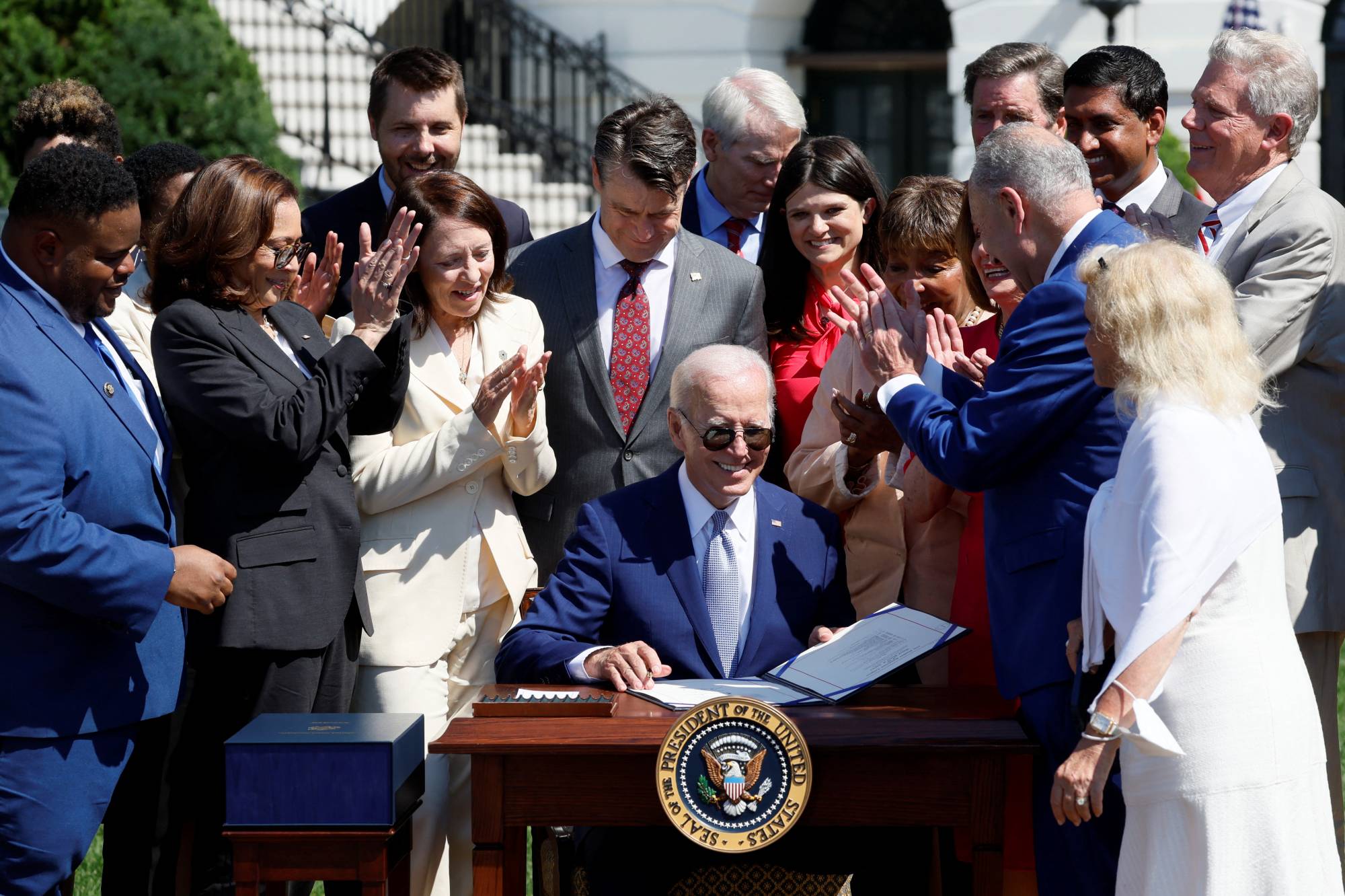 U.S. President Joe Biden signs the Chips and Science Act of 2022, at the White House on Aug. 9. | REUTERS