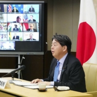 Foreign Minister Yoshimasa Hayashi speaks at an online international conference on COVID-19 on Wednesday. | FOREIGN MINISTRY / VIA KYODO
