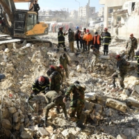Algerian rescue teams take part in the search and rescue operations in Syria\'s northern city of Aleppo on Wednesday, two days after a deadly earthquake struck Syria and Turkey. | AFP-JIJI