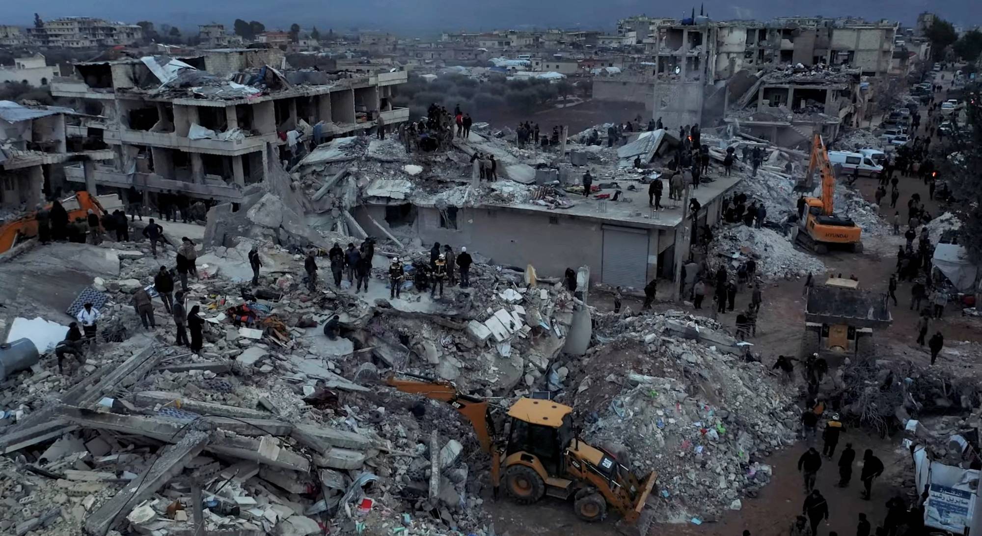 Damaged buildings and rescue operations are seen in the aftermath of the earthquake, in Aleppo on Tuesday. | White Helmets / via REUTERS