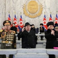 North Korean leader Kim Jong Un, along with his wife, Ri Sol Ju, and their daughter, believed to be named Kim Ju Ae, (seated at the back) attend a military parade to mark the 75th founding anniversary of North Korea\'s army, at Kim Il Sung Square in Pyongyang on Wednesday. | KCNA / VIA REUTERS   