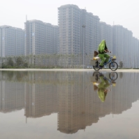 Chinese households save mainly in the form of housing and financial investments. Last year they delayed purchases of homes and other financial assets in favor of keeping their money in banks. | REUTERS