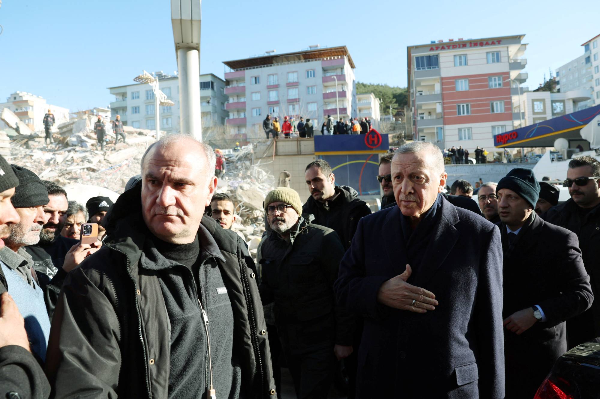 Turkish President Recep Tayyip Erdogan inspects damage in the aftermath of a deadly earthquake in Kahramanmaras, Turkey, on Wednesday. | PRESIDENTIAL PRESS OFFICE / VIA REUTERS
