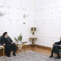 Iranian President Ebrahim Raisi meets with the new chief commander of the Iranian police force, Ahmad-Reza Radan, in Tehran on Jan. 14. | PRESIDENTIAL WEBSITE / WEST ASIA NEWS AGENCY / VIA REUTERS 