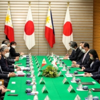 Marcos (fourth from left) and Kishida (second from right) told talks at the prime minister\'s official resident in Tokyo on Thursday. | POOL / VIA REUTERS