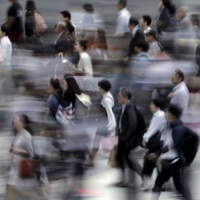 Japanese firms have long been reluctant to pass on costs to budget-minded consumers, which in turn have led to wages being subdued. | BLOOMBERG