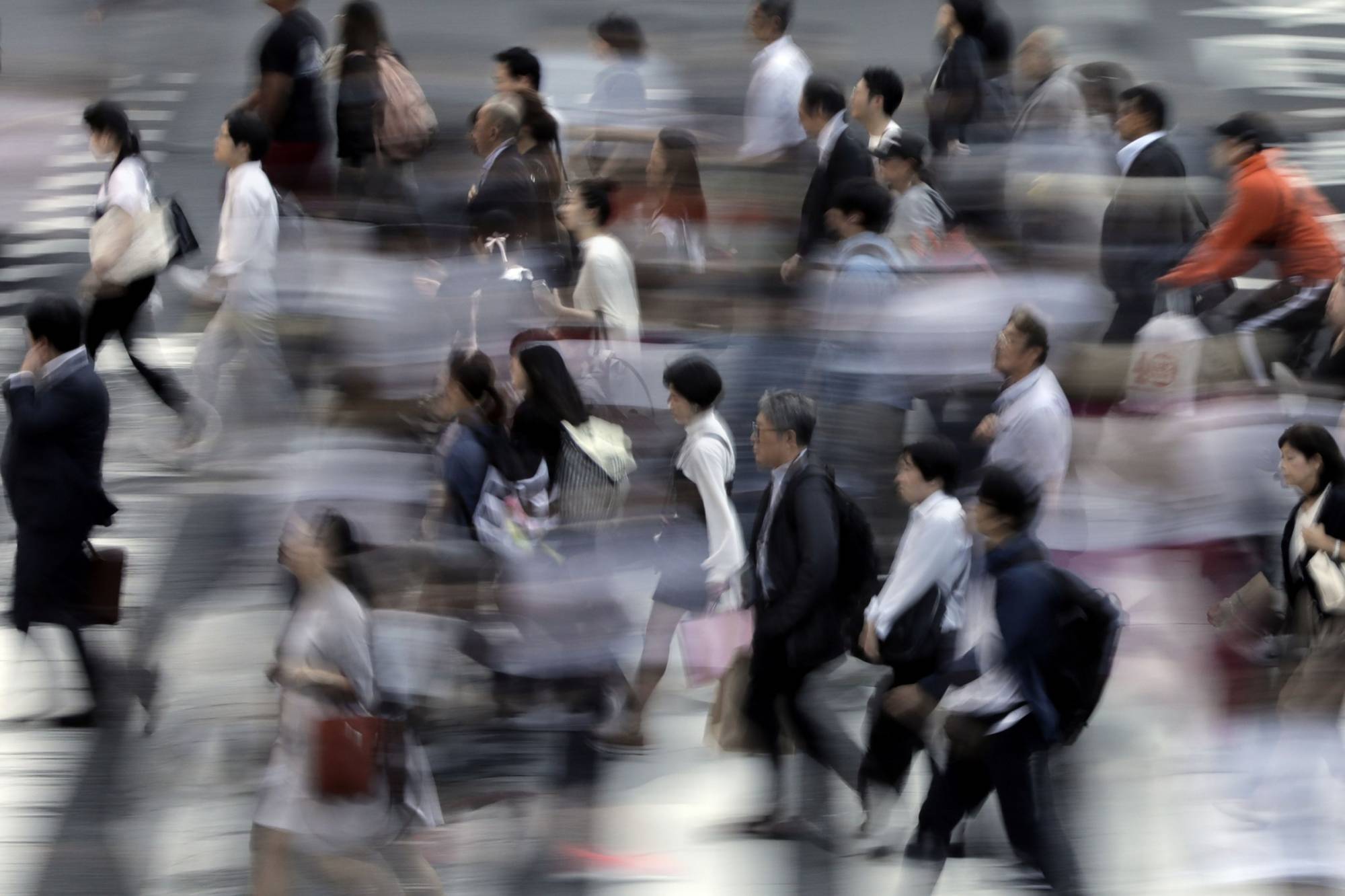 Japanese firms have long been reluctant to pass on costs to budget-minded consumers, which in turn have led to wages being subdued. | BLOOMBERG