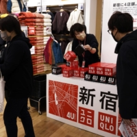 Apparel giant Fast Retailing has said it would raise wages by as much as 40% for full-time employees from March. | BLOOMBERG