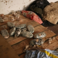 Mouldy bread, mattresses and clothes litter a warehouse where Russian forces were based during their recent occupation | REUTERS