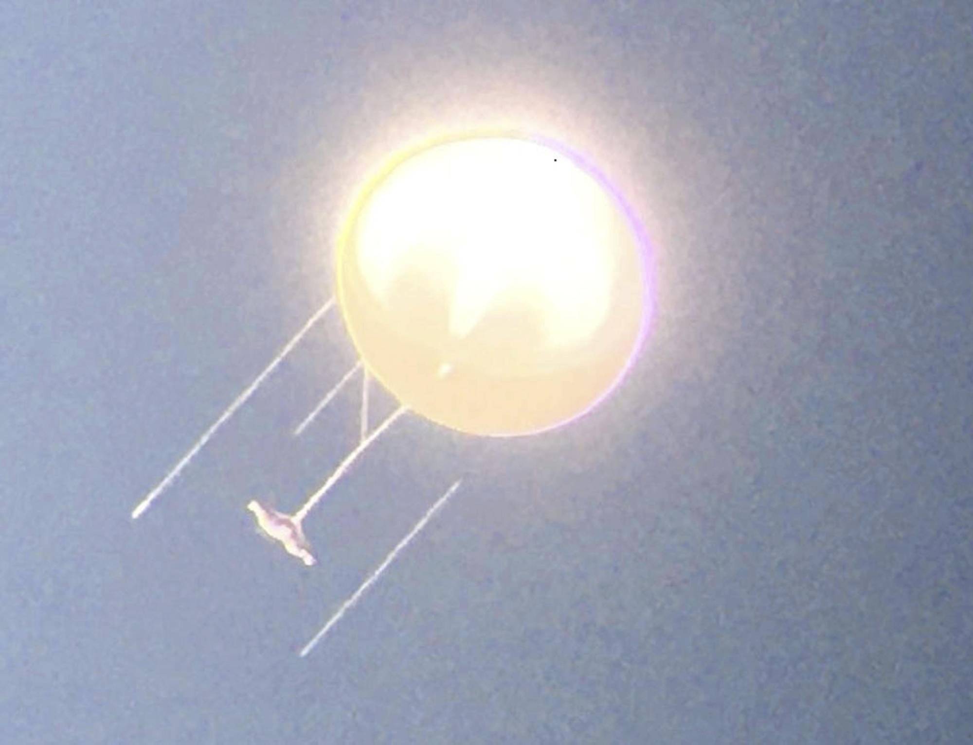 A flying object resembling a suspected Chinese spy balloon that flew over the U.S. this month is seen in a photograph taken by a Sendai Space Museum employee through a telescope in Satsumasendai, Kagoshima Prefecture, on Nov. 20, 2019. | COURTESY OF SENDAI SPACE MUSEUM / VIA KYODO