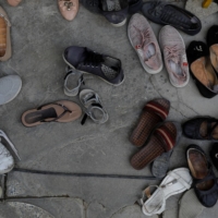 Shoes of Afghan women outside a religious school in Kabul | REUTERS