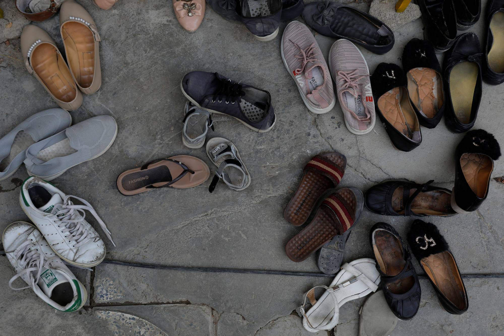 Shoes of Afghan women outside a religious school in Kabul | REUTERS