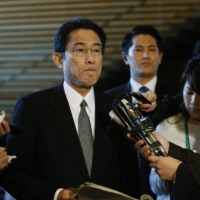 Then-Foreign Minister Fumio Kishida is questioned by reporters in Tokyo in January 2015.  | REUTERS
