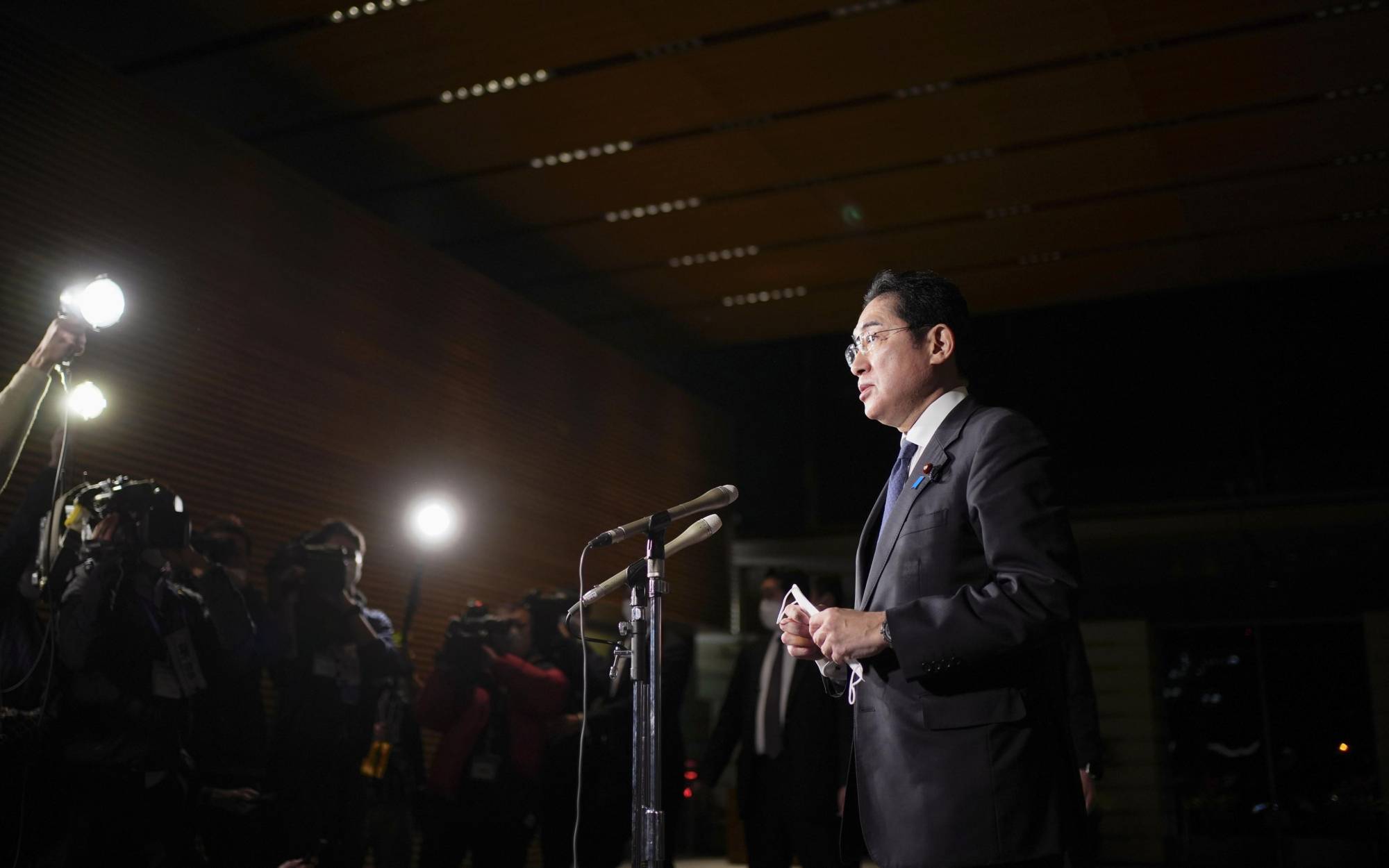 Prime Minister Fumio Kishida speaks to reporters in Tokyo on Saturday evening after North Korea fired an ICBM-class weapon. | KYODO