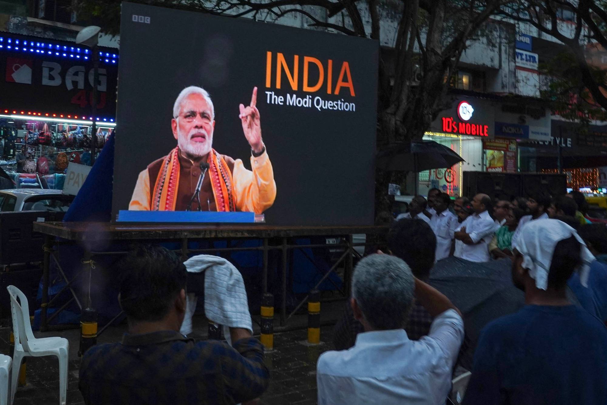 People watch the BBC documentary 'India: The Modi Question' in the city of Kochi, India, on Jan. 24. The documentary examines Prime Minister Narendra Modi's role during deadly 2002 sectarian riots.  | (PHOTO BY ARUN CHANDRABOSE / AFP)