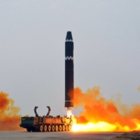 A North Korean Hwasong-15 intercontinental ballistic missile is fired from Pyongyang International Airport in this image released Sunday.  | KCNA / KNS / VIA AFP-JIJI
