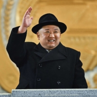 North Korean leader Kim Jong Un observes a military parade celebrating the 75th anniversary of the founding of the Korean People\'s Army in Pyongyang in this photo released on Feb. 9. | KCNA / KNS / VIA AFP-JIJI