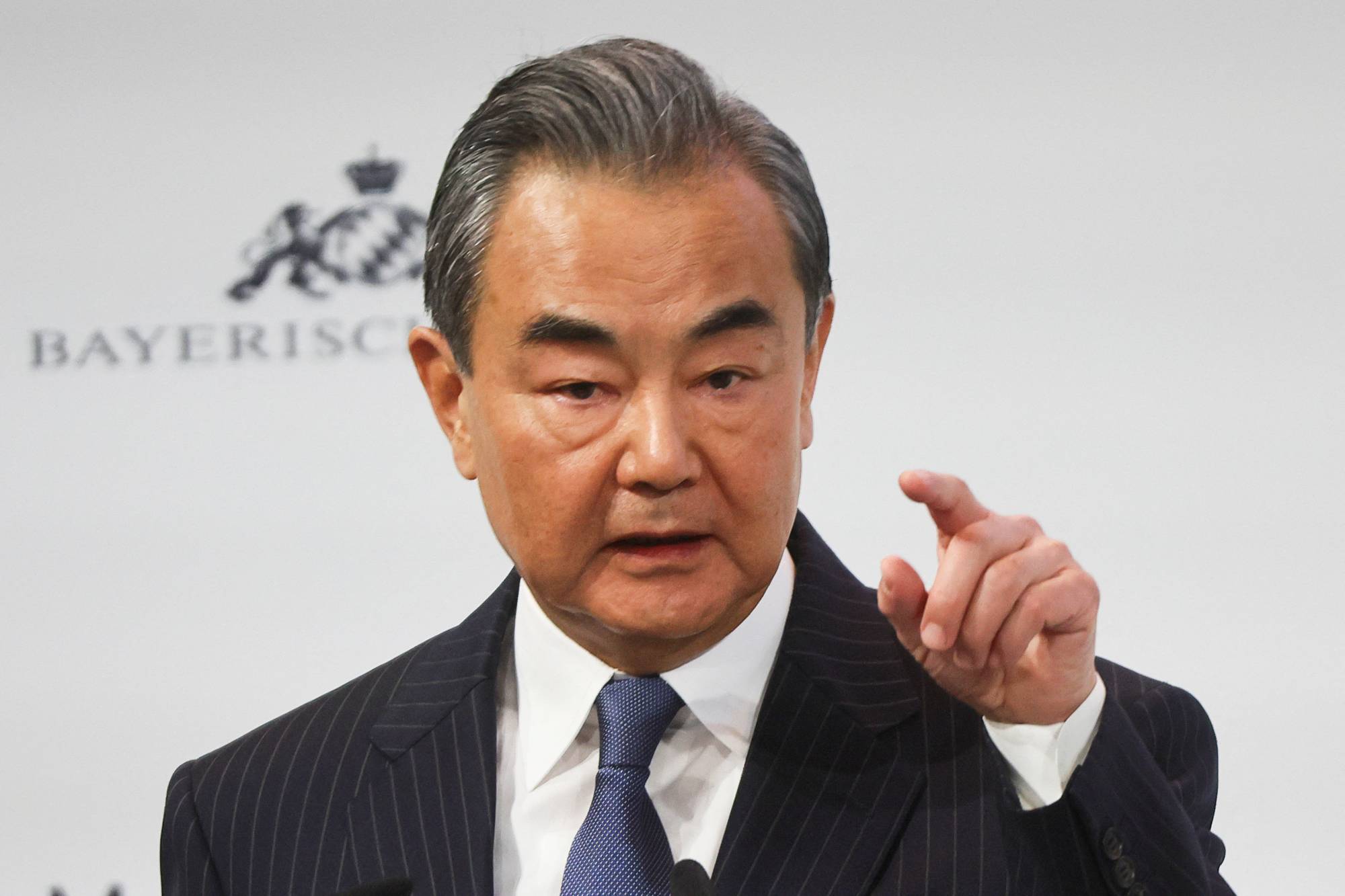 Chinese State Councilor Wang Yi speaks during the Munich Security Conference in the German city on Saturday. | REUTERS