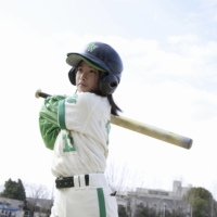 A young girl steps up to bat for her team. Baseball season is around the corner, and it\'s one of Japan\'s favorite pastimes.  | GETTY IMAGES