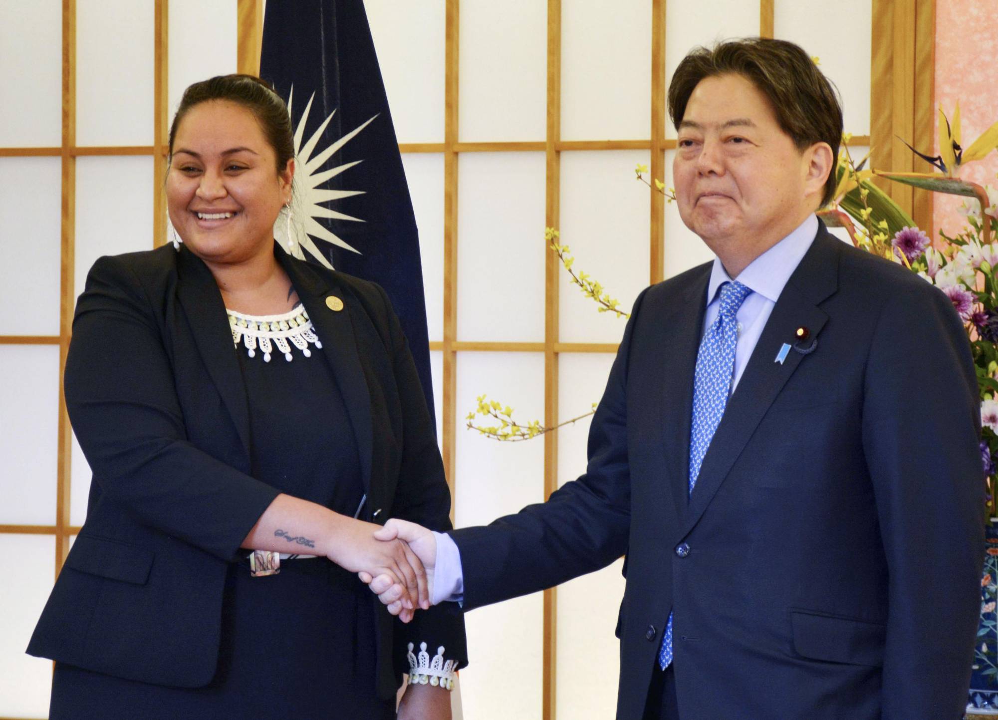Foreign Minister Yoshimasa Hayashi (right), meets with his Marshall Islands' couterpart, Kitlang Kabua, at the Foreign Ministry in Tokyo on Feb. 8.  | KYODO