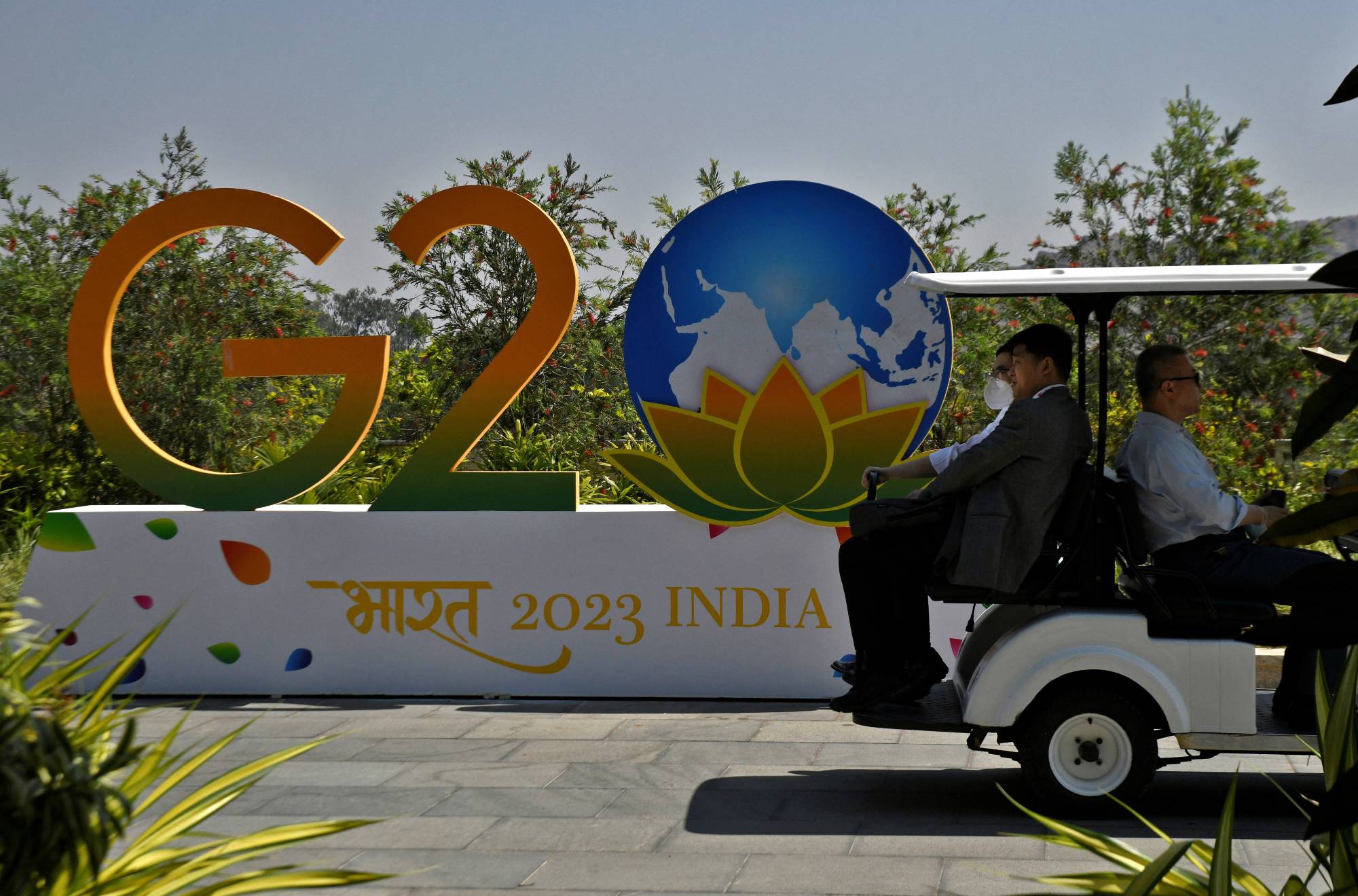 Delegates ride in a buggy at G20 finance officials meeting venue near Bengaluru, on Thursday | REUTERS